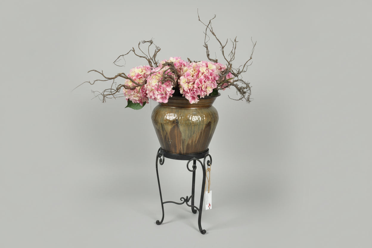Green metal pot with stand with Pink Hydrangea Floral Arrangement